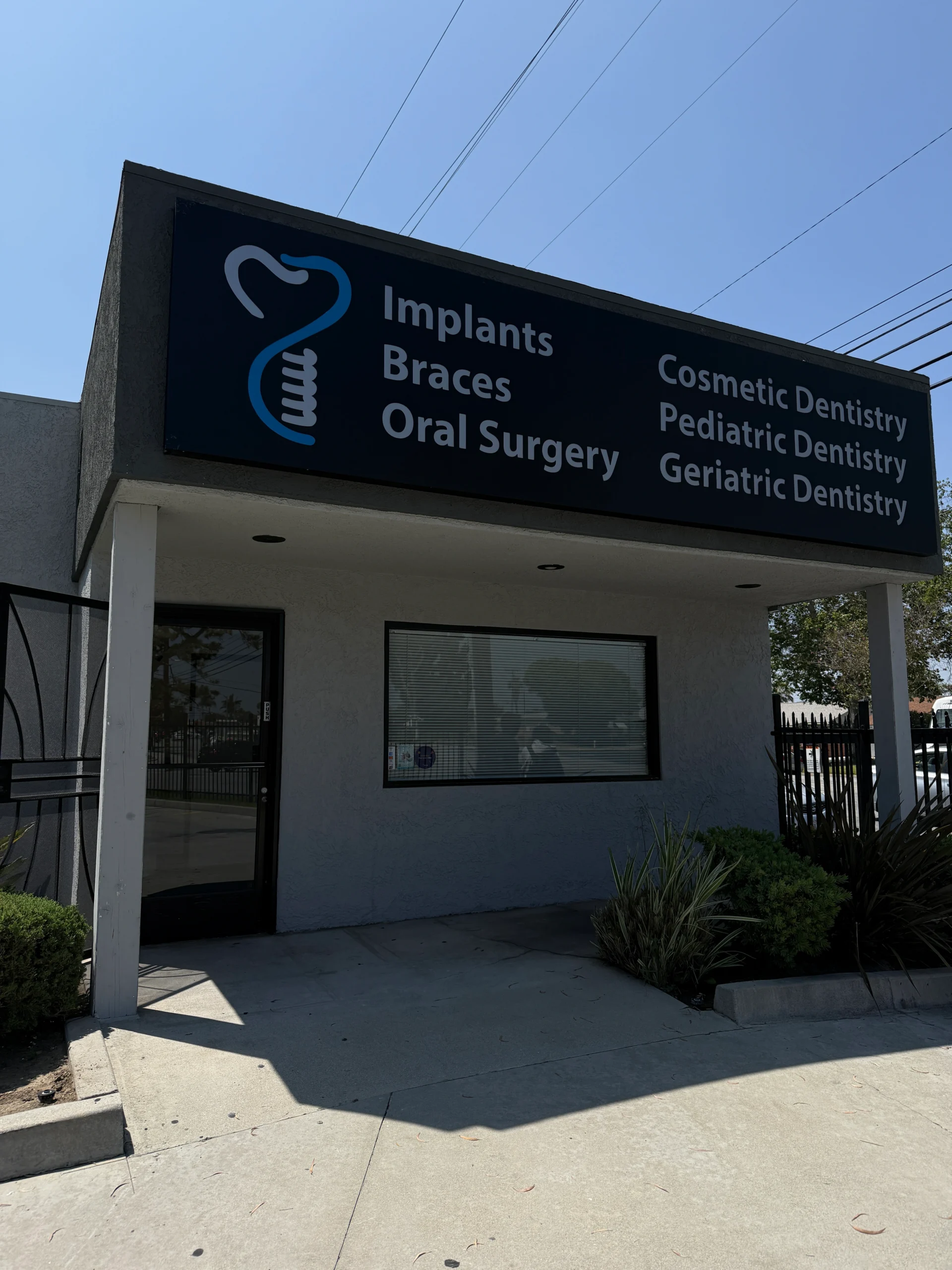 Dental clinic exterior with signage.